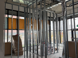 Commercial renovation project by GEL Construction showcasing a modern, functional interior with updated flooring, energy-efficient lighting, and custom-built fixtures. The transformed space features clean architectural lines, improved accessibility, and a layout designed for high-traffic use, tailored to meet business operational needs.