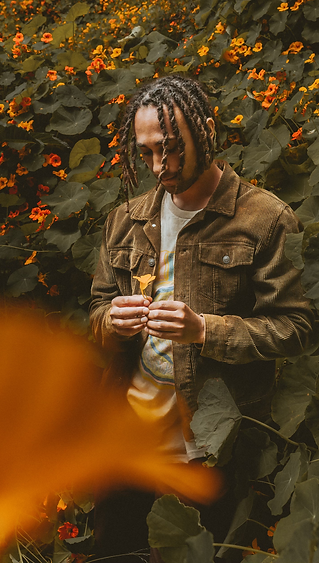 Photo of Nathan Darmody with Orange Flower
