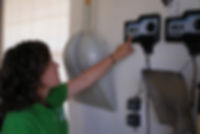 employee pointing to irrigation timer