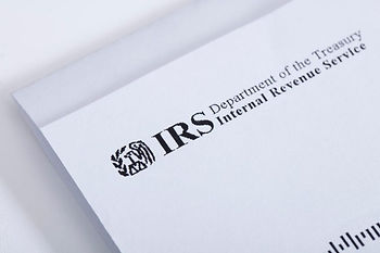 IRS Notice folded on white table