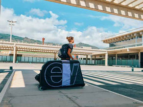 A woman travelling with bike box.