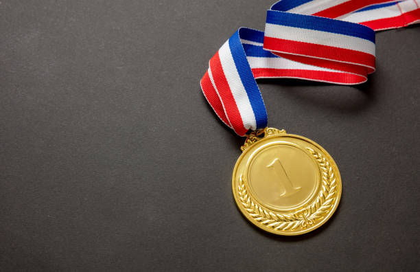 Thumbnail: Gold medal from AnBJ Collection displayed on a plain background.”
