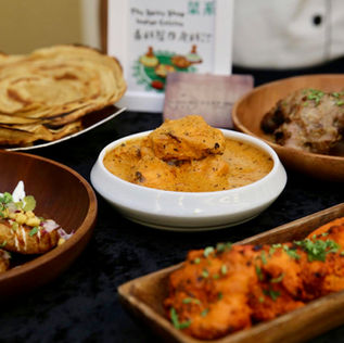 Delicious Indian dishes: butter chicken, naan, and tandoori