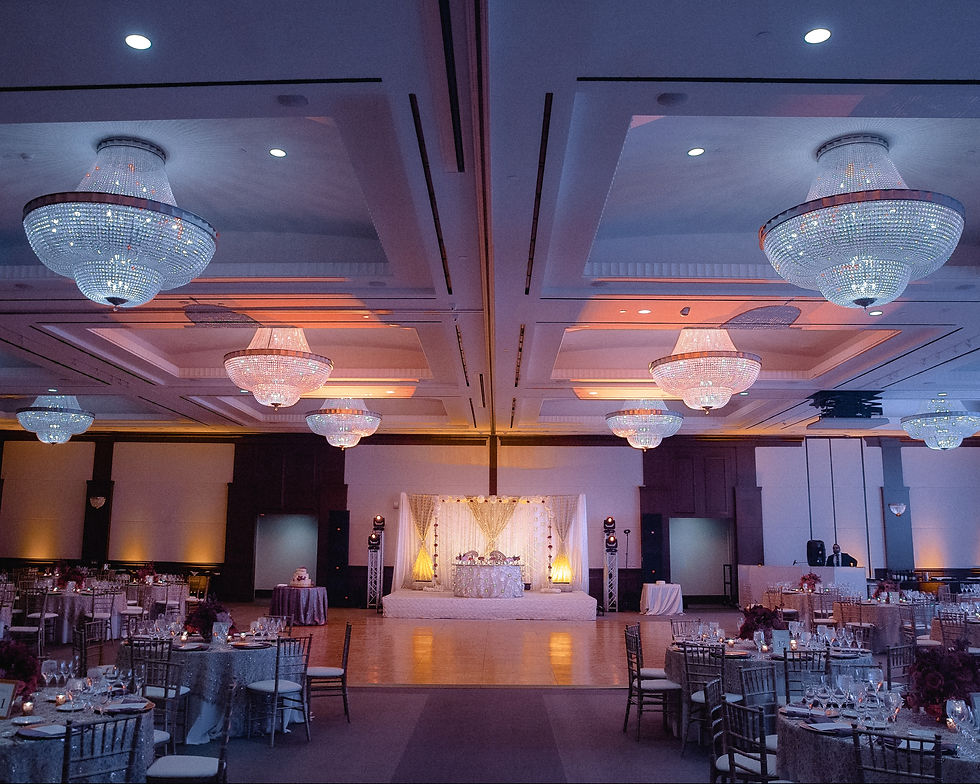 Ballroom with tables is decorated for a wedding reception
