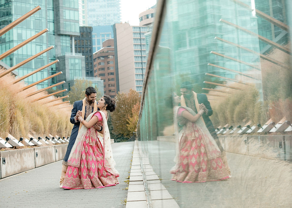 groom dips thee bride slightly as they rehearse their wedding dance in downtown
