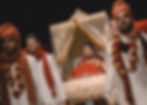 Bride is brought into the ceremony location in an Indian doli