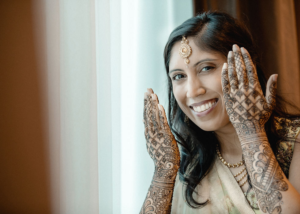 Indian girl showing the henna on her hands