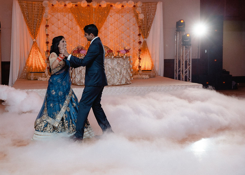 bride and groom dance in the dry ice fog.