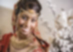 a close-up of Indian bride in red