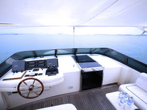 Luxury yacht cockpit with steering wheel and ocean view