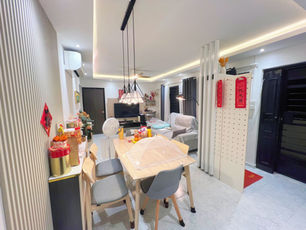 Stylishly renovated HDB corridor unit in Singapore featuring modern furniture, pendant lights, and festive home decor—showcasing privacy and aesthetic transformation.