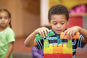 child building building with legos