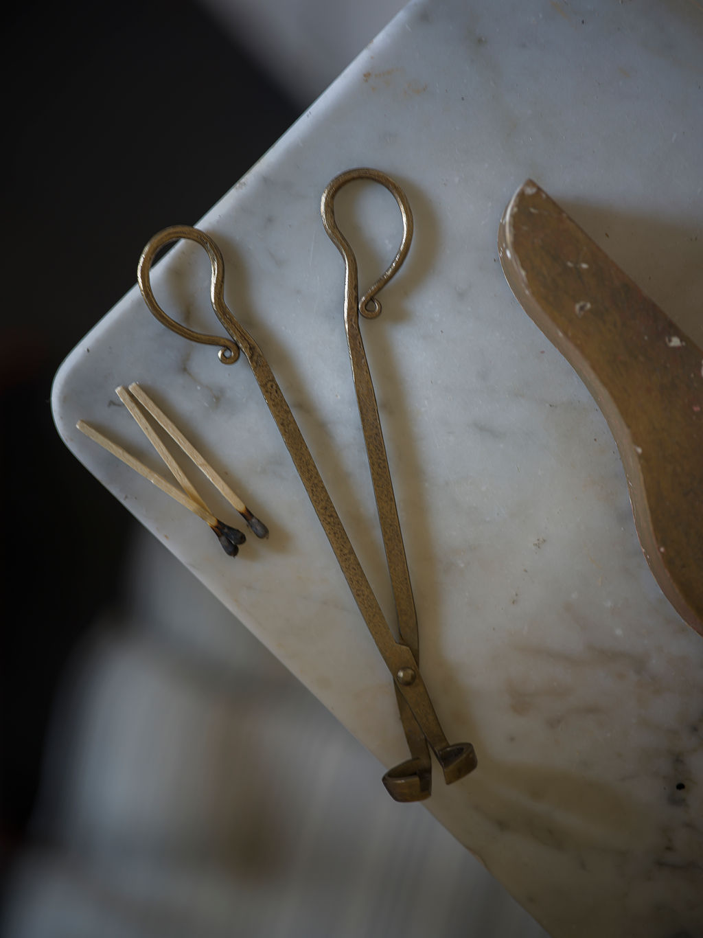 Antique brass wick trimmers made from iron, designed for candle care with a vintage-inspired finish & cotton drawstring bag