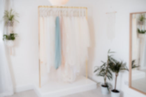 Bridal gowns waiting to be tried on by bridal appointments at Love in Lace, Kent.