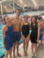 Four PAAC swimmers at a meet