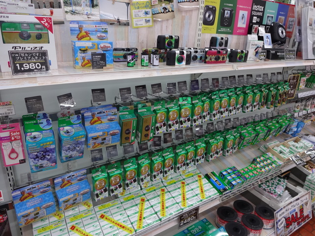 Store rack with many disposable cameras