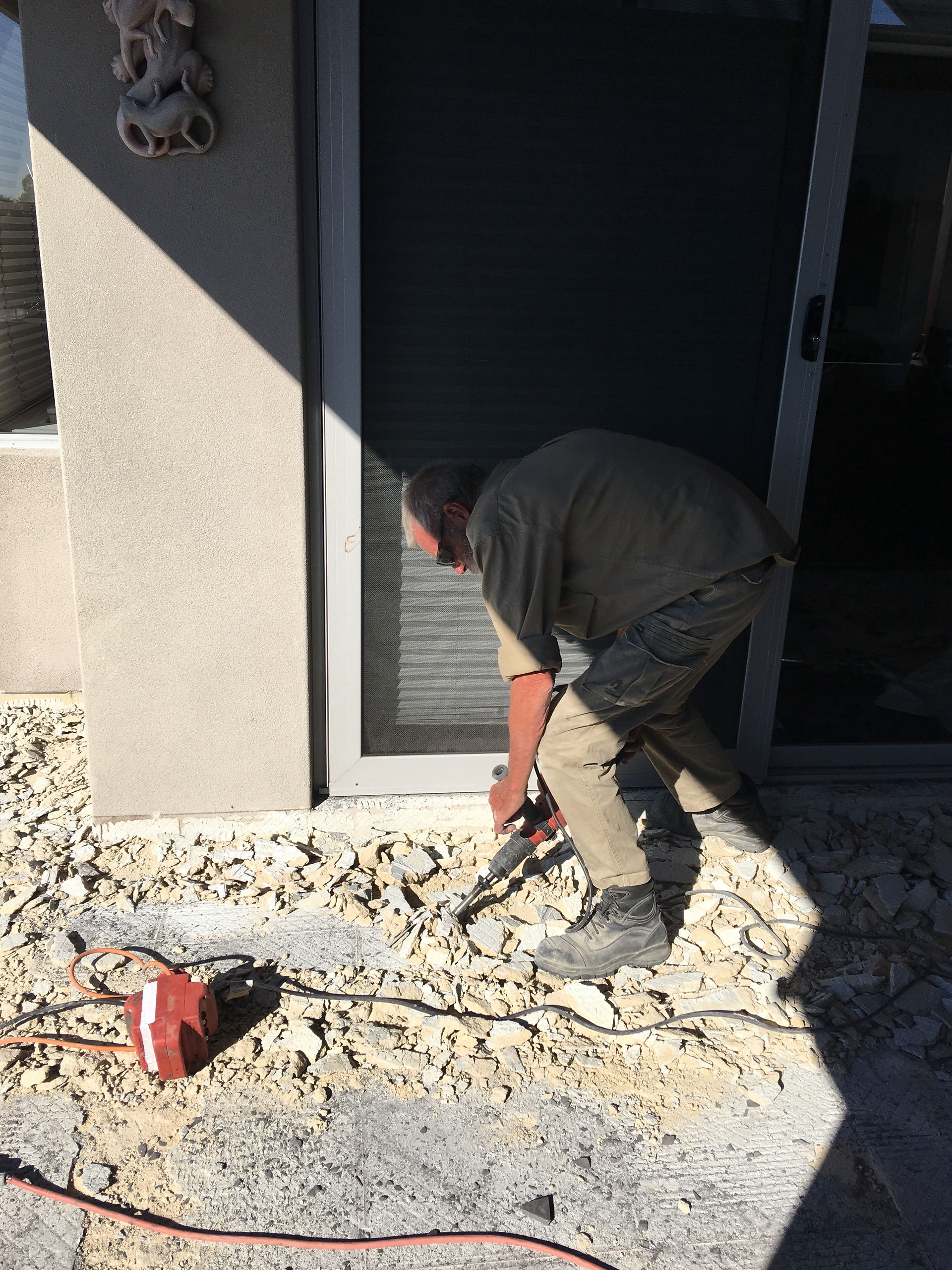 Conspar works begin at this Wembley Downs 
property that has been experiencing water ingress problems. The first stage involves removing the original tiled floor of the balcony.