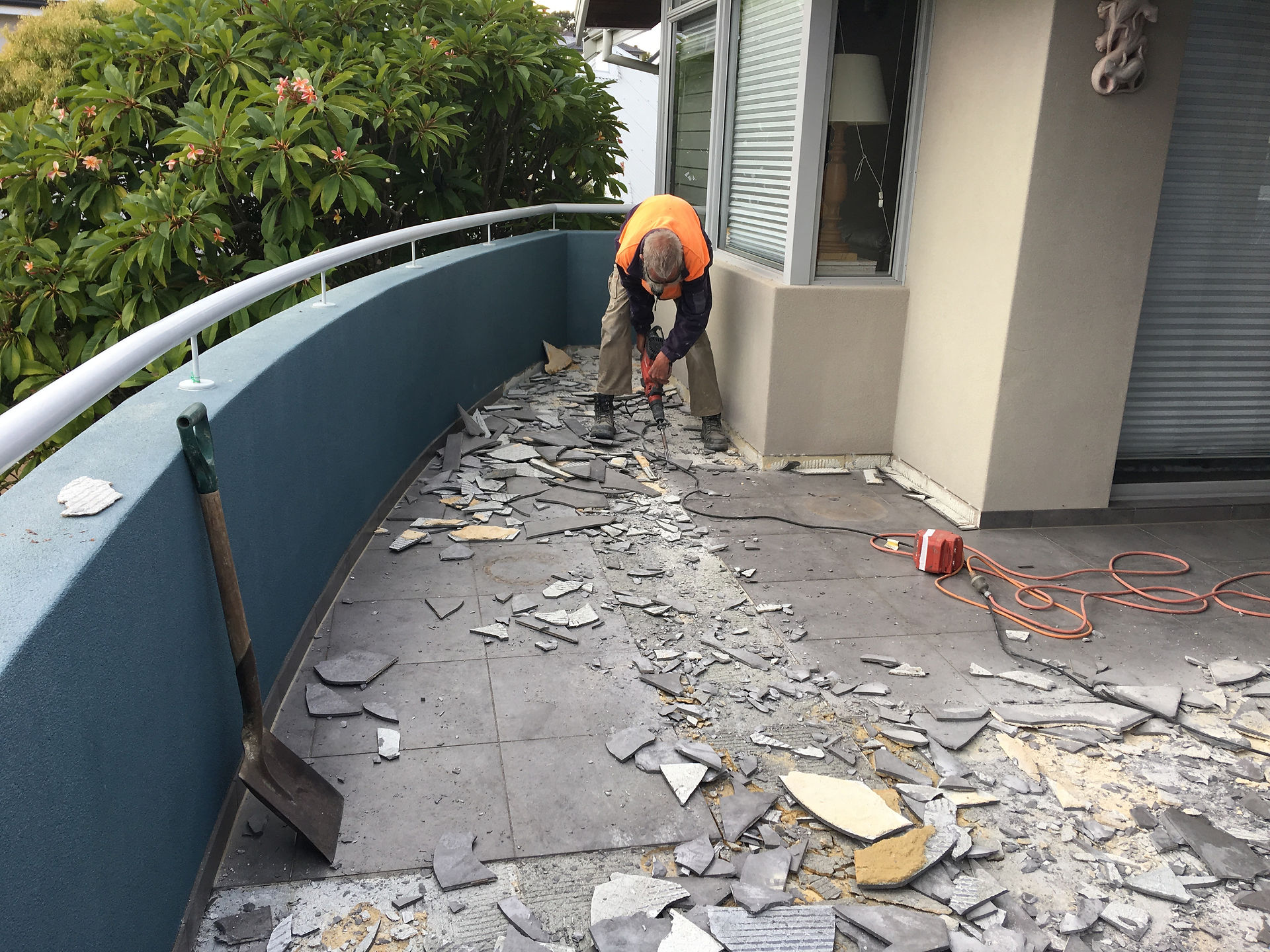 Conspar works begin at this Wembley Downs 
property that has been experiencing water ingress problems. The first stage involves removing the original tiled floor of the balcony.