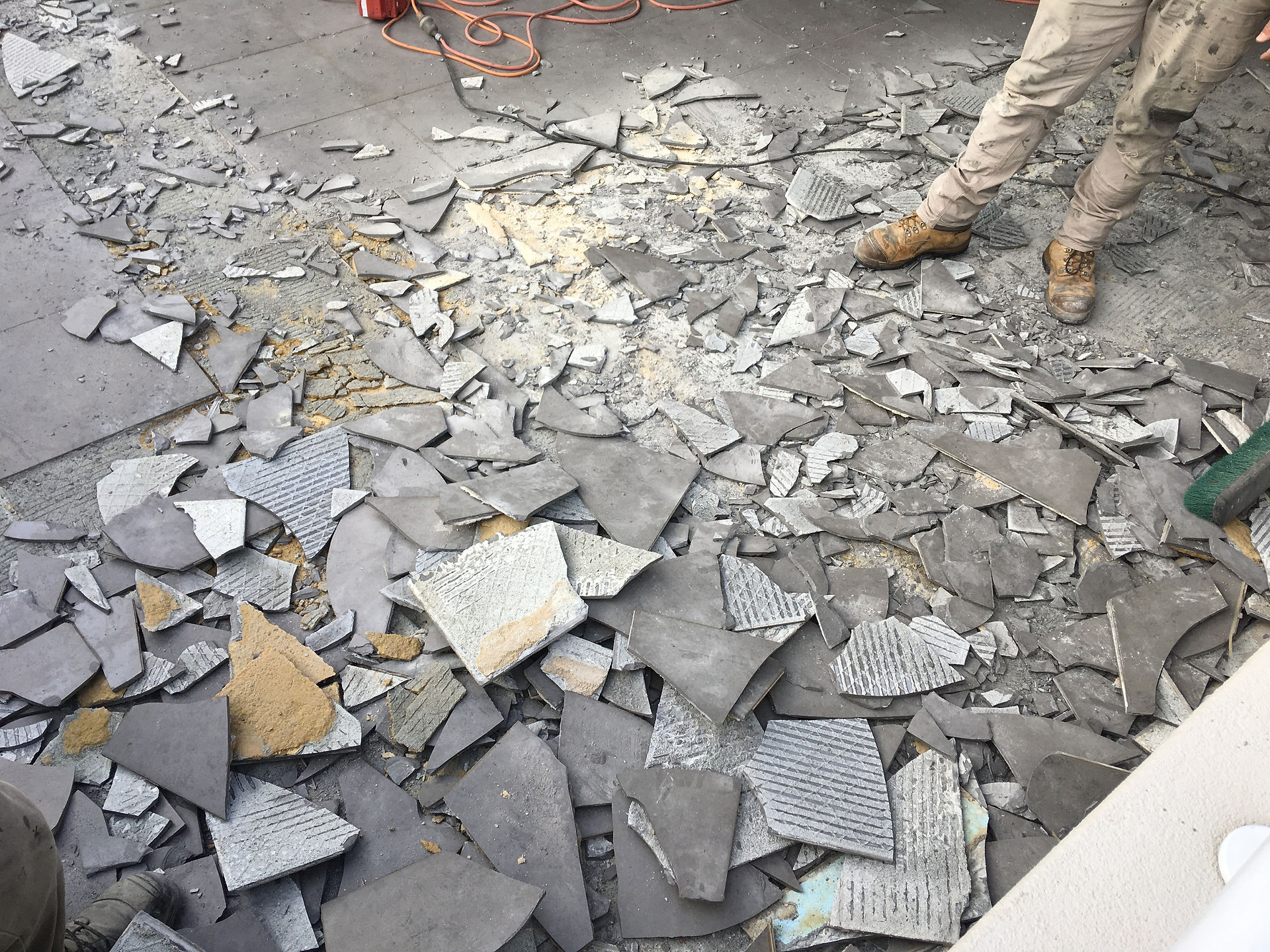 Conspar works begin at this Wembley Downs 
property that has been experiencing water ingress problems. The first stage involves removing the original tiled floor of the balcony.