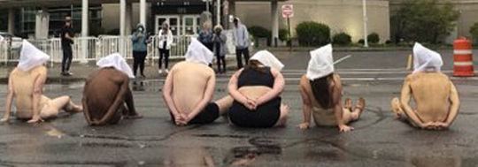 People are tried in public with their faces covered