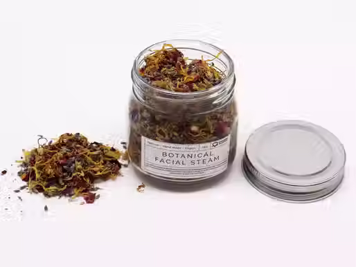 Bote con mezcla botánica para vapor facial