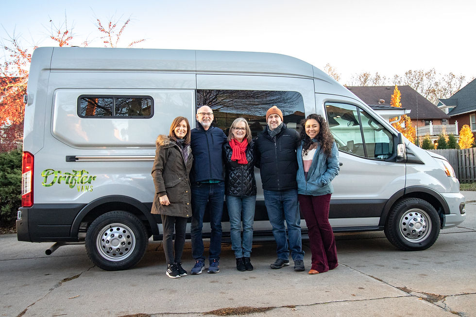 Clients Kevin and Belinda standing in front of their new Drifter Van with Paul Domish and interior designer Kathleen at delivery.