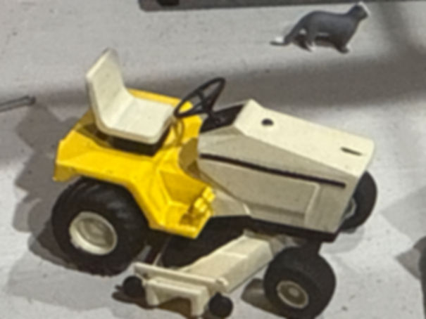 Yellow and white mower