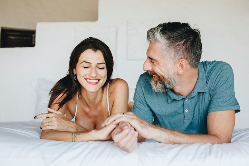A couple smiling due to optimal hormonal health.
