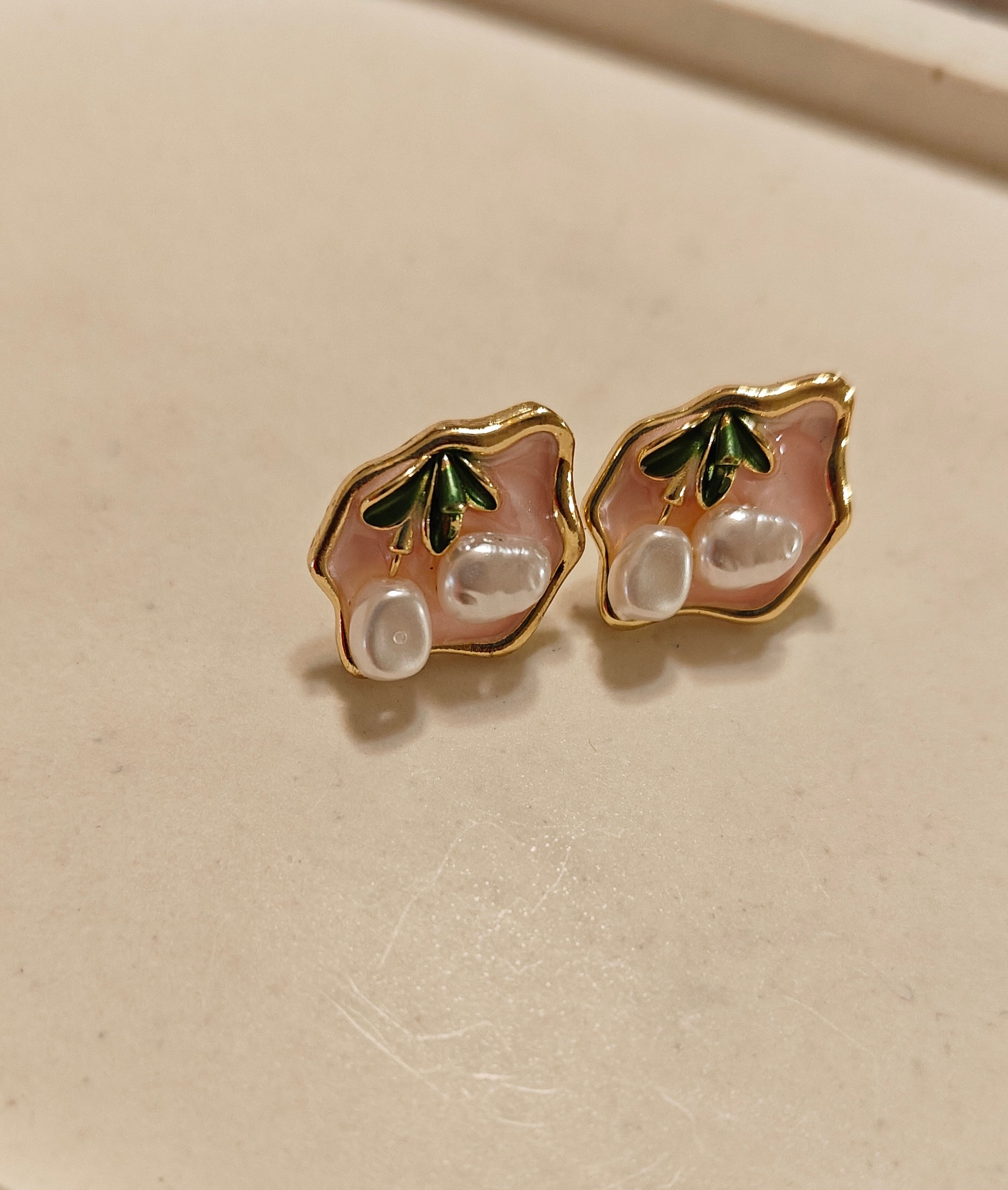 Asymmetric pink studs with pearl