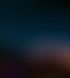 Campervan parked under a starry night sky, glowing with interior lights. Trees in the background create a serene, adventurous mood.