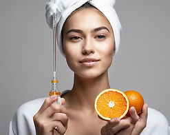 female with orange and syringe