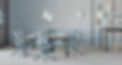 Work table surrounded by six Cosm chairs in glacier colour