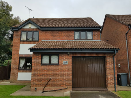 Upvc anthracite grey fascia boards finished off with grey deepflow guttering and downpipes completed