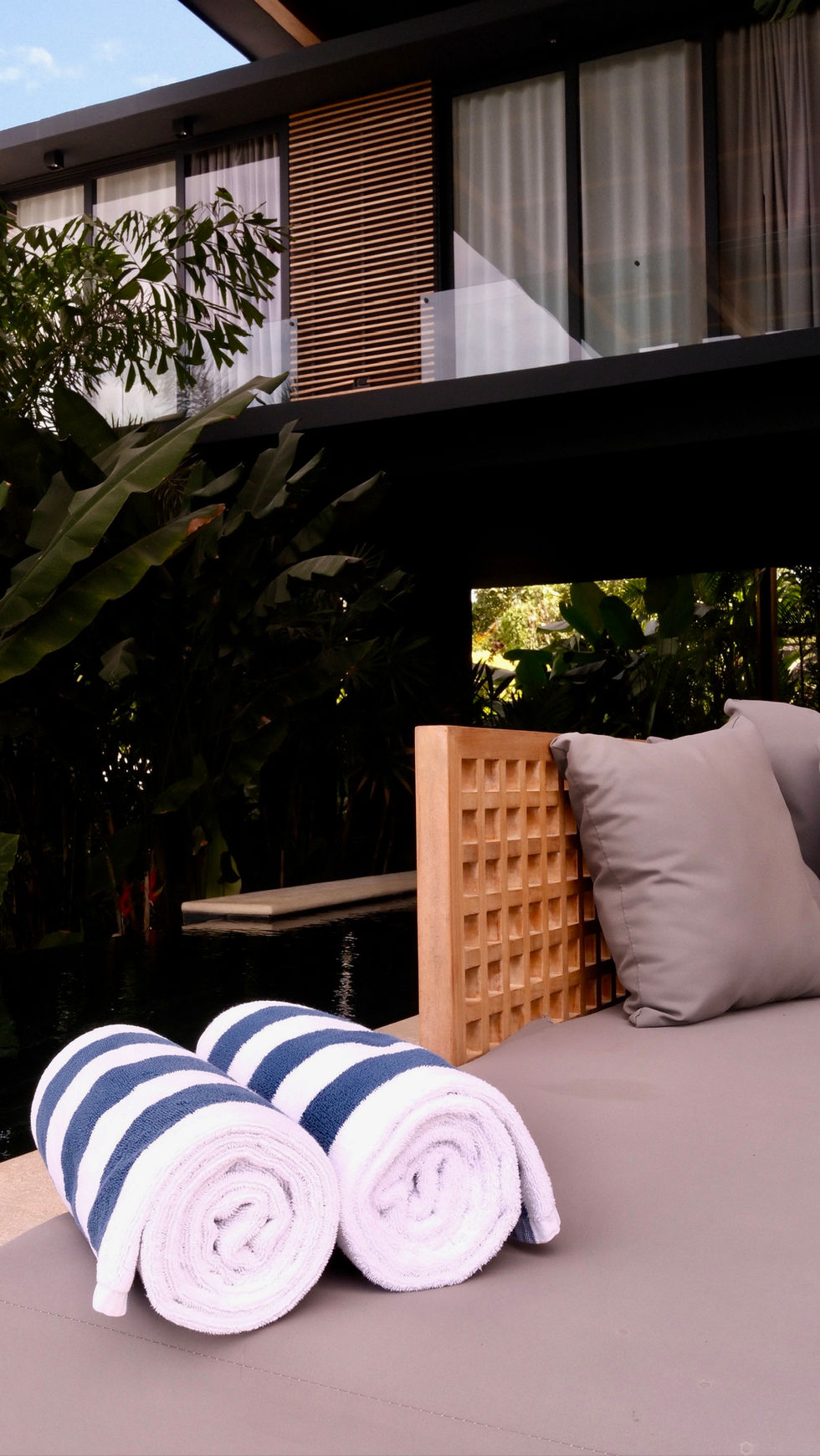 Luxury lifestyle photography of oceanfront lounge beds, produced by Cocoia Creative Agency for a high-end private villa marketing campaign in Costa Rica.
