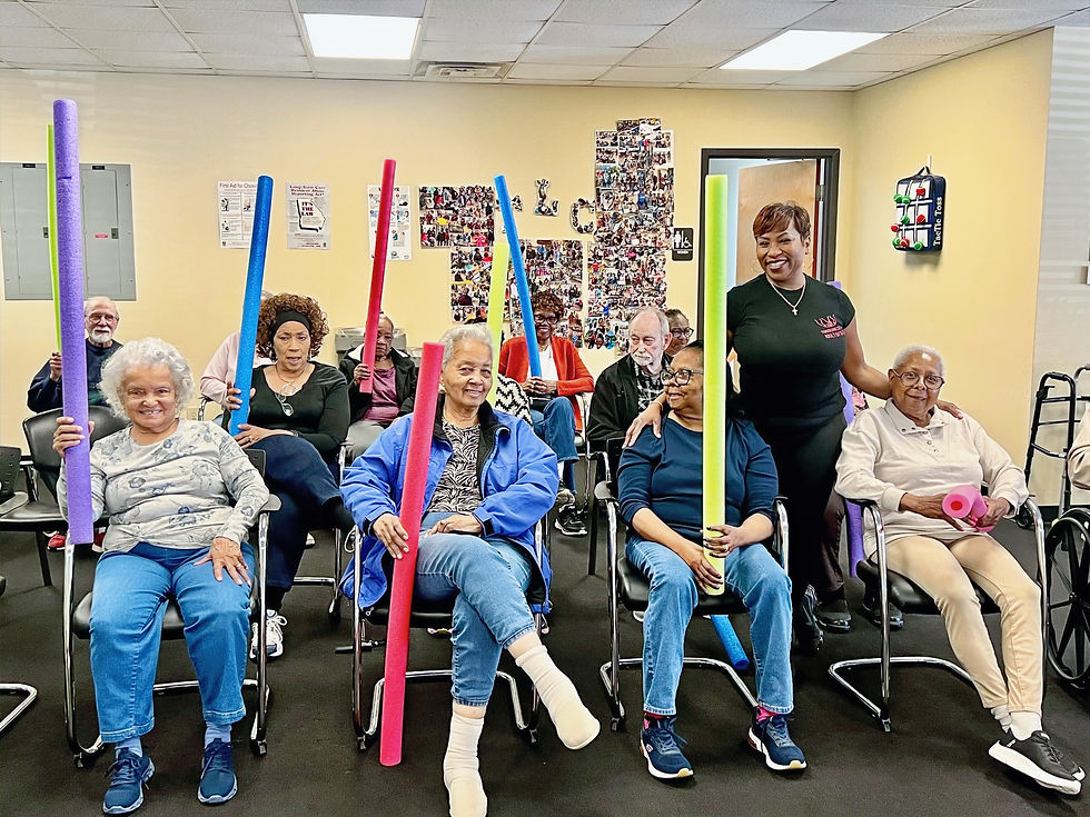 Seniors participating in a seated exercise activity at Tender Living Care