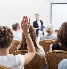 Hand raised during a seminar