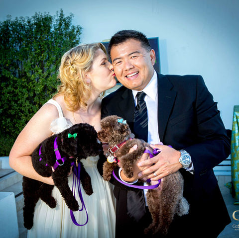 Wedding couple bride and groom holding their Dogs at Wedding The Beverly Hilton Hotel. Pet photography at weddings. Los Angeles Wedding Photographer. GoShiggyGo Shiggy