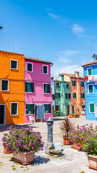 colourful buildings courtyard burano island venice italy