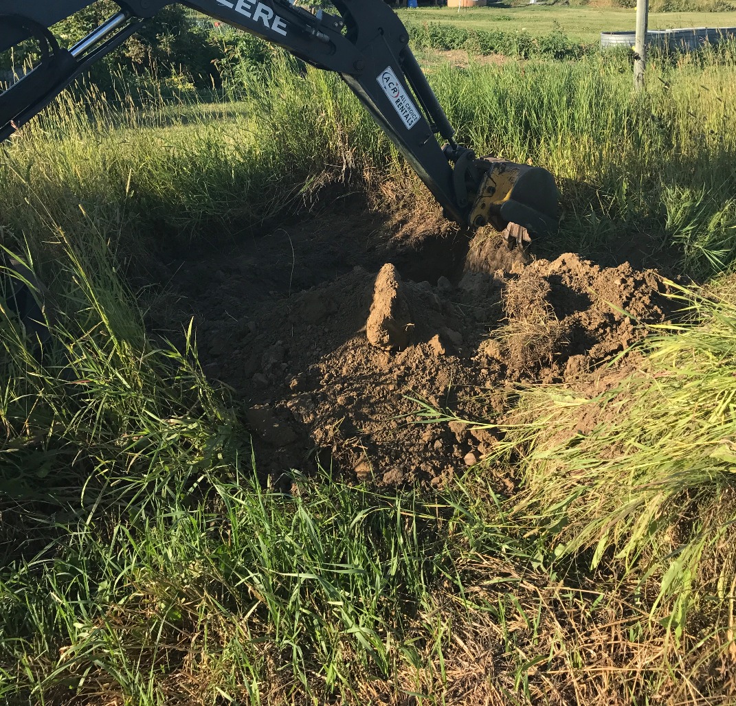 Digging a test pit for a site evaluation