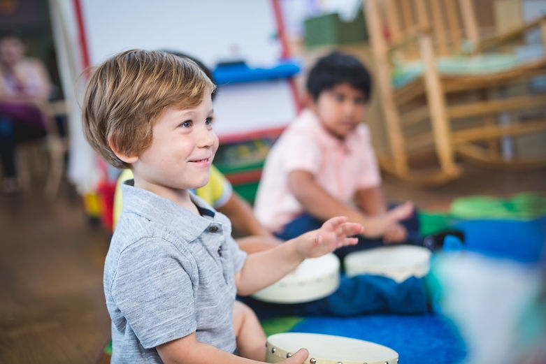 Photo_Kindermusik_BucktownMusic-2016-Boy-playing-drum-3-1024x683.jpg
