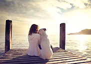individual woman with dog on dock healing after individual therapy
