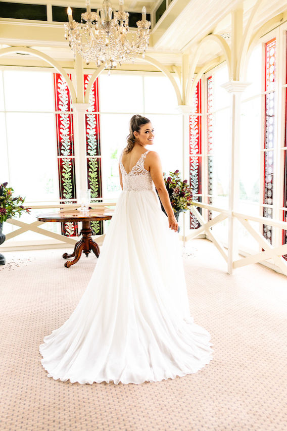 Shine On by Purple Fox – A-line gown with beaded lace bodice, sheer lace straps, chiffon skirt, and button detail