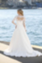 Esperance GR100 A-line gown with beaded lace high neck, long pearl-button sleeves and flowing chiffon skirt. Back View