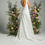 Thumbnail: Back view: Lace bridal gown with low scoop back and slim A-line skirt