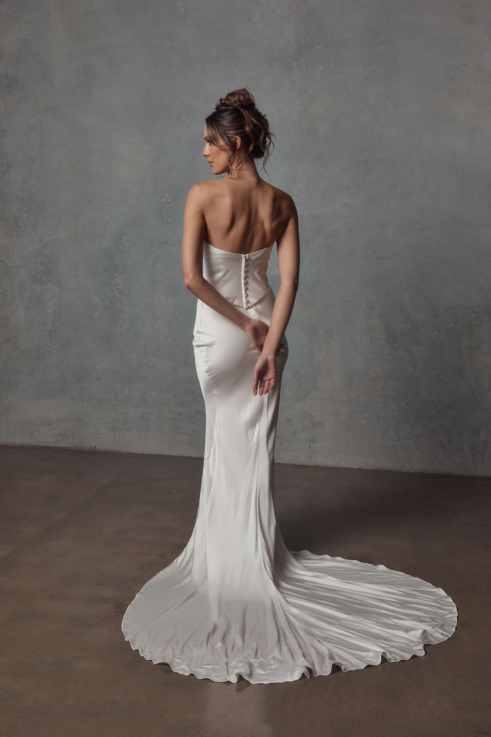 Back view of ‘Brandie Corset’ and ‘Brandie Skirt’ by Jack Sullivan Bridal in silk-satin blend