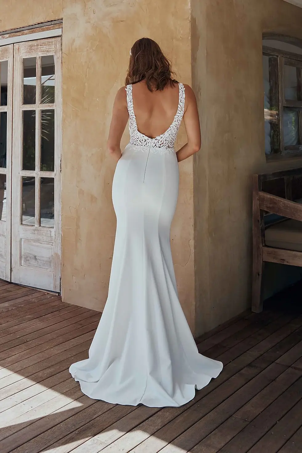 Back view of the Simone TC2345 Wedding Dress highlighting sheer V neckline and beaded lace detailing.