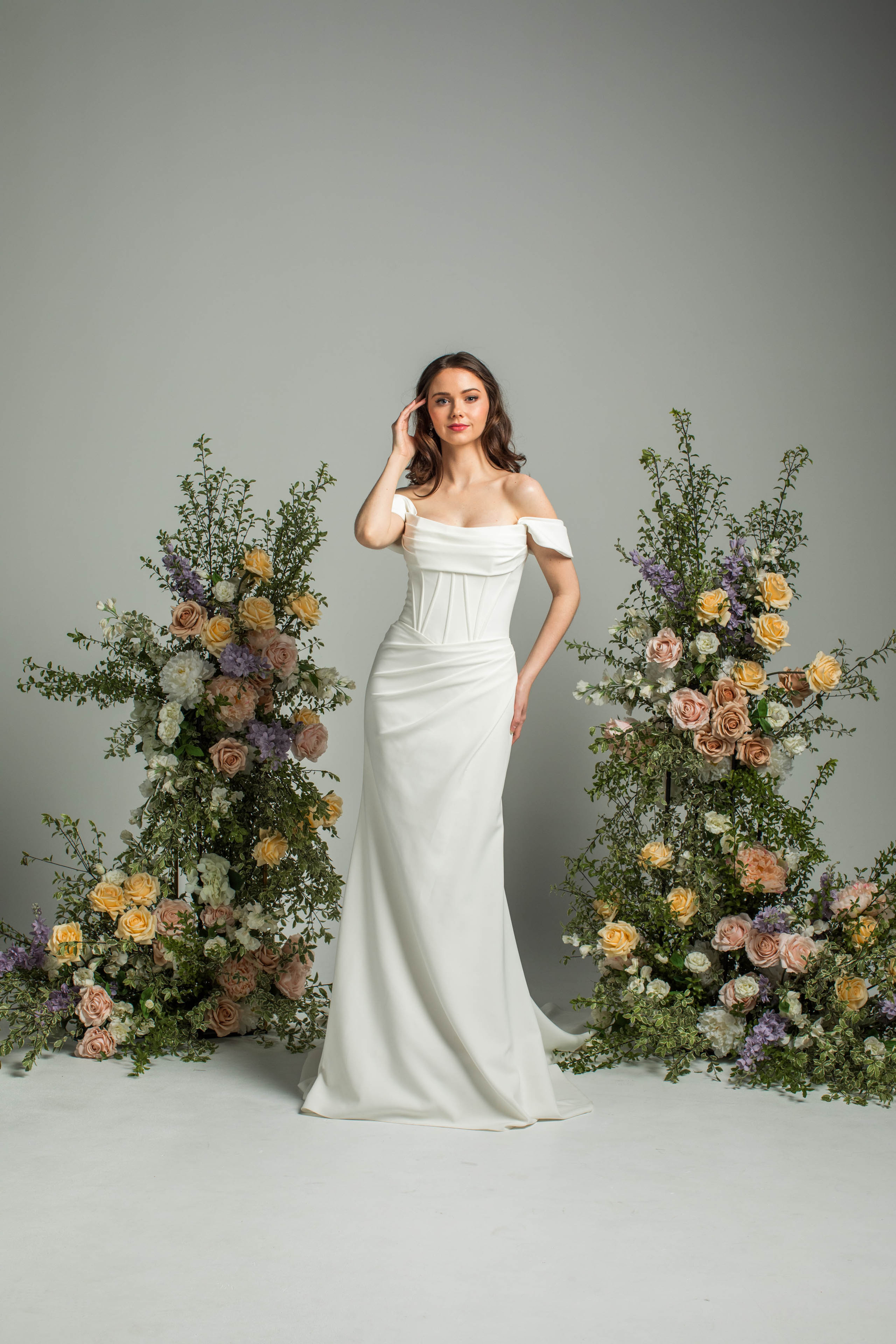 'Gravity' J215 by Jean Fox, fitted crepe gown with draped skirt and fan boning detail, front view