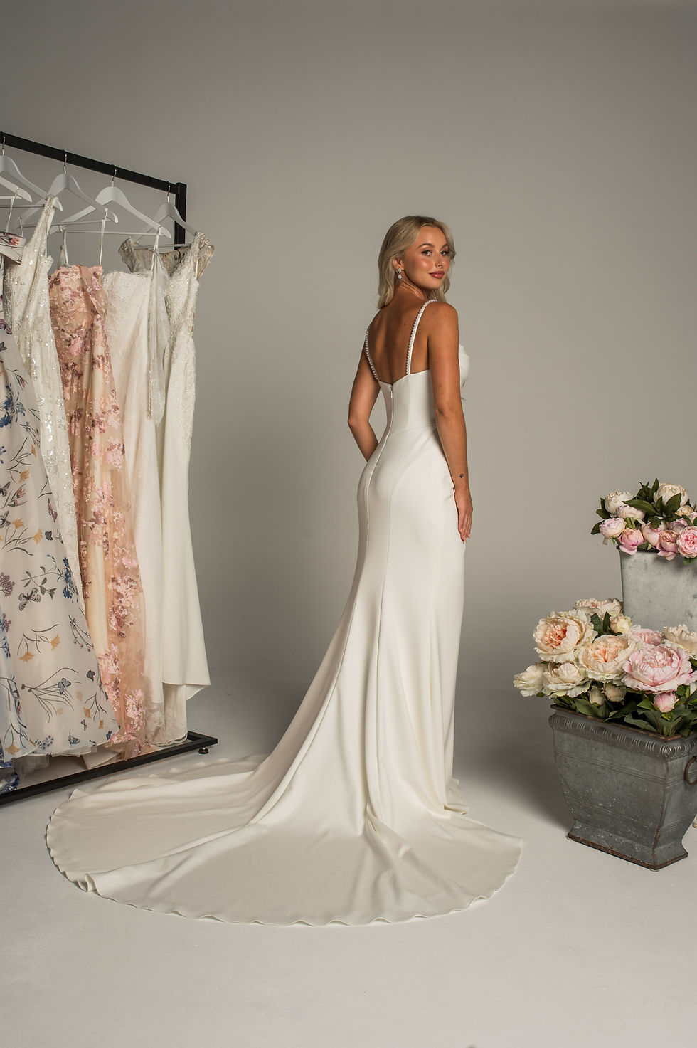 Back view: Luminous Times PF508 showing fitted silhouette with draped skirt and clean back