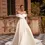 Thumbnail: Bona wedding dress by Dama Couture – off-the-shoulder satin gown with ruched bodice, waterfall skirt, and hidden slit.