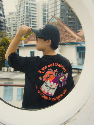 Dancer framed in a circular window, showing the jam jar back print of the black tee